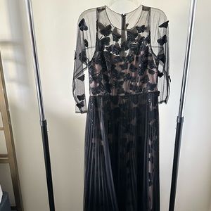 Marchesa Notte butterfly black dress with long sleeves.